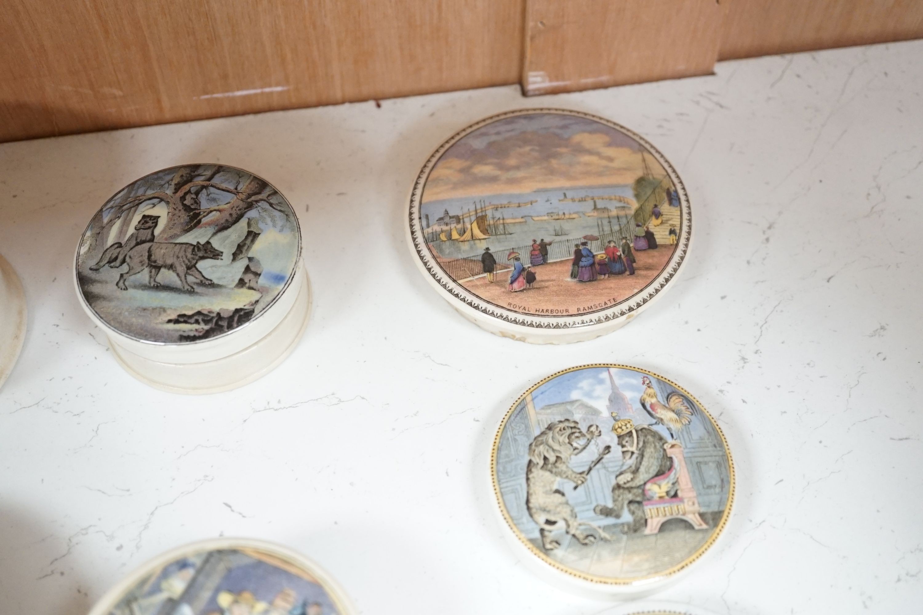 Ten Victorian pot lids including six bear's grease, largest 10.5 cms diameter.